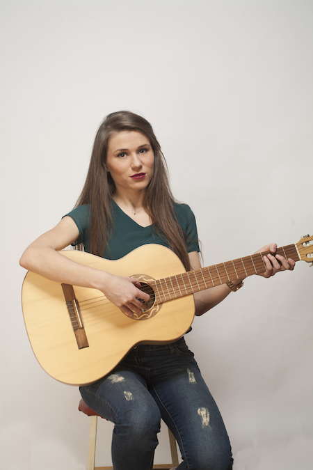 Woman Playing the Classical Guitar