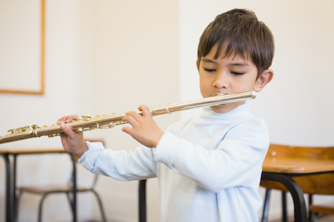 Child Playing the Flute At School