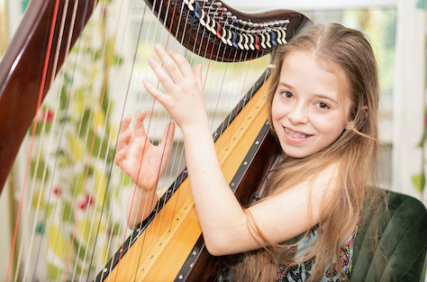 Girl playing the harp