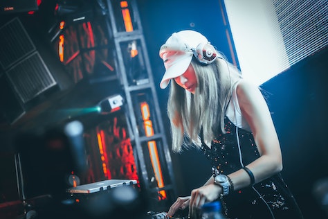 Woman on stage mixing music