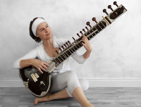 Male Guitarist at Home