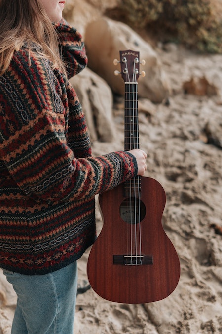 Woman holding the ukulele