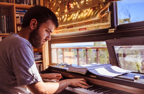 Pianist playing piano at home
